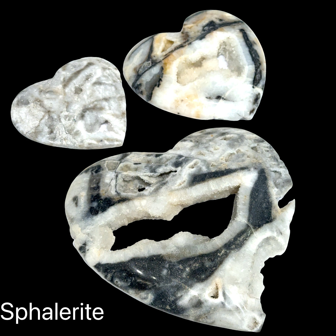 Three heart-shaped sphalerite crystals on a black background with 'Sphalerite' text, front view.
