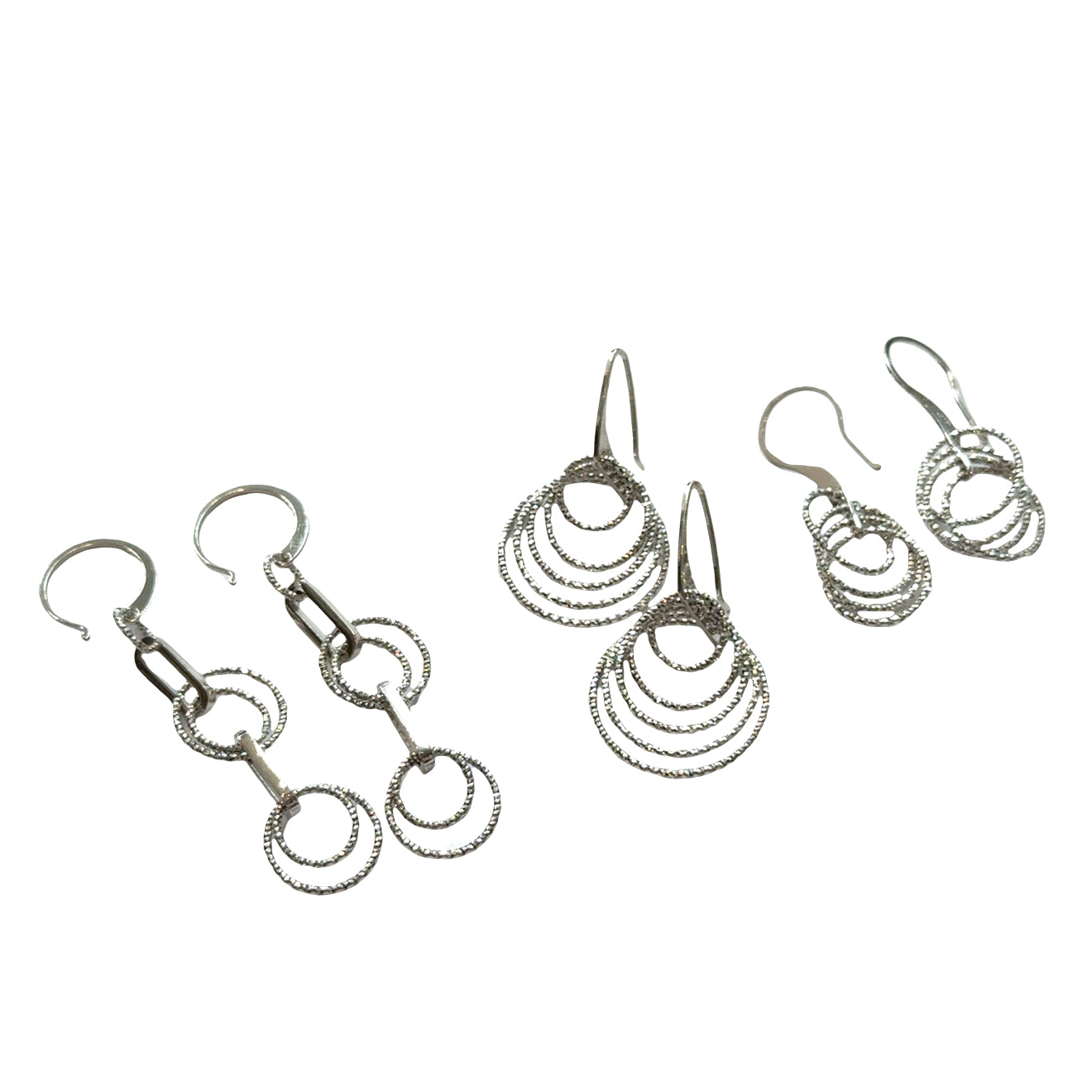 Three set of three different style diamond  cut Multi-circle sterling silver dangle earrings showing sparkle and movement on a white background, front hanging overview.