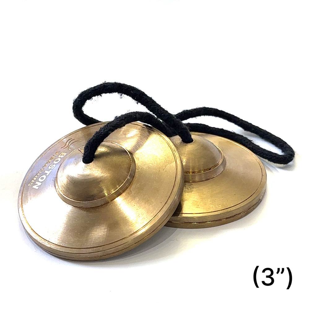 Tinsiga cymbals crafted by certified sound therapist for meditation and energy clearing on white overview