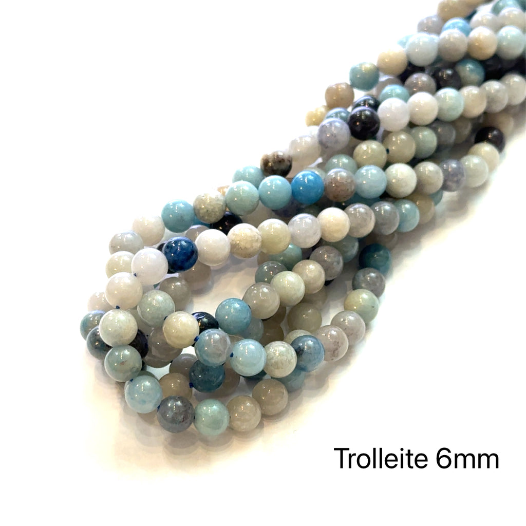 Trolleite Gemstone Strand 6mm round on white center overview