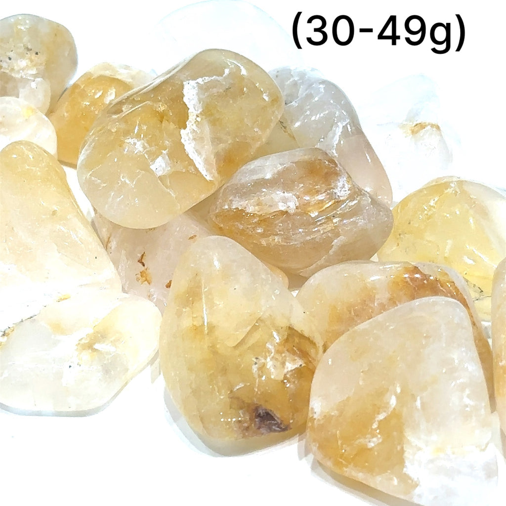 Tumbled Golden Healer gemstone for meditation and spiritual communication grouping  (30-49g) on white overview