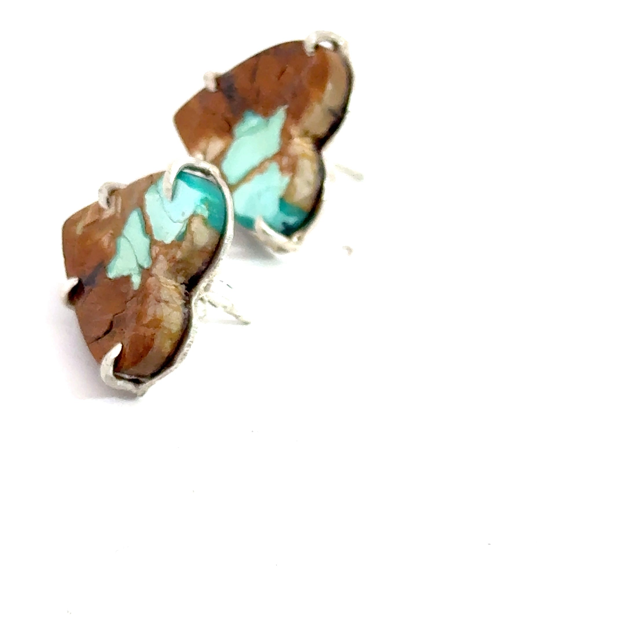 Turquoise and brown stone heart earrings on a white background, left side view.