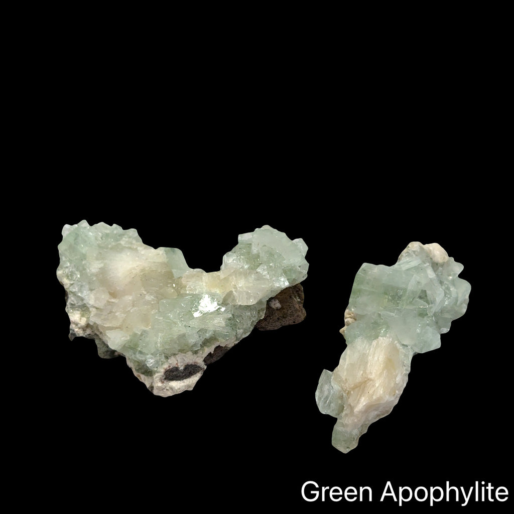 Two Green apophyllite crystal cluster with pyramid terminations for heart chakra healing third eye activation and spiritual vision with angelic connection energy on a black background, front view.