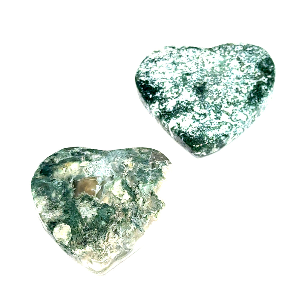 Two Moss Agate heart carving for abundance and healing energy on a white background front view. 