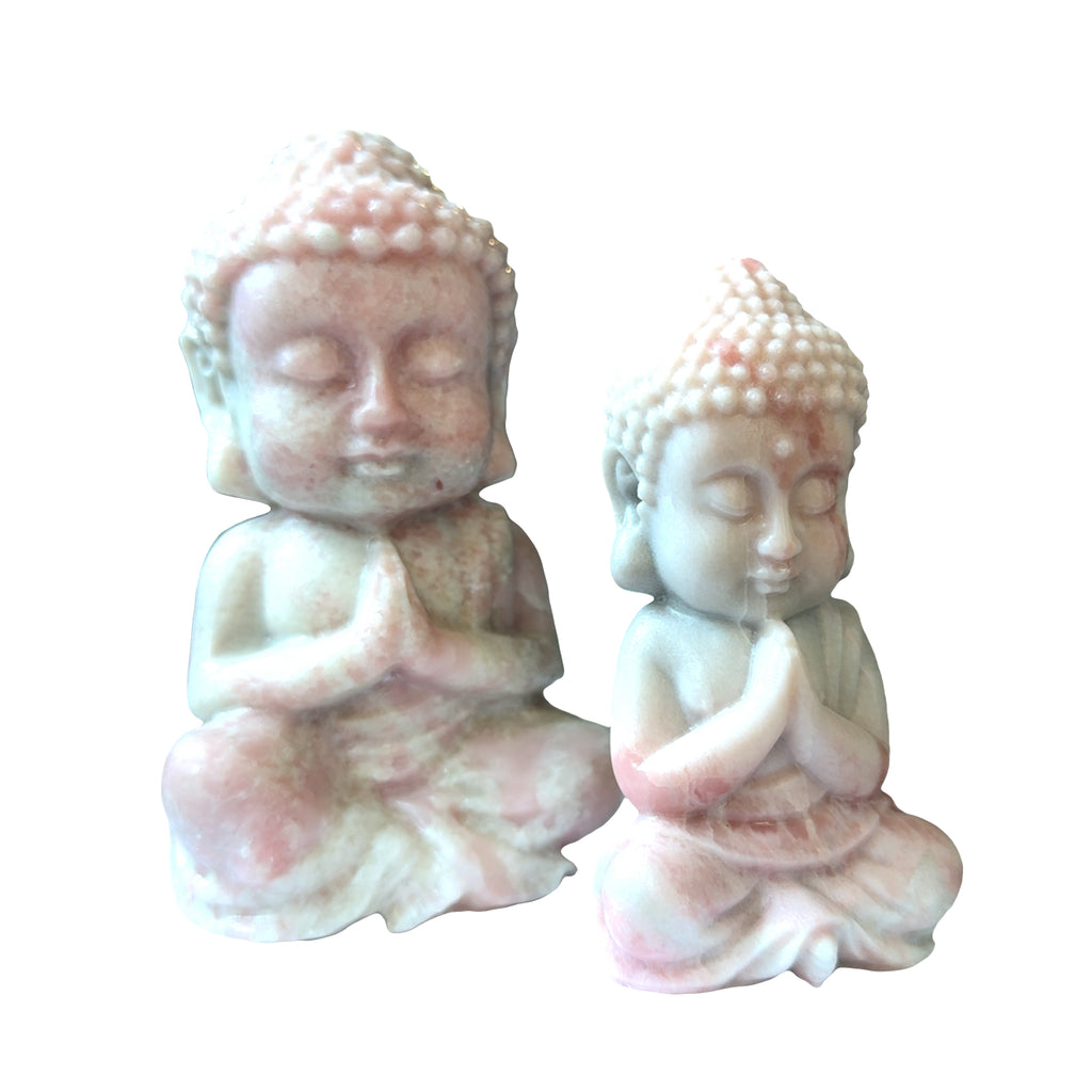 Two Pink opal Buddha carving in meditation pose for emotional healing on a white background, front overview. 