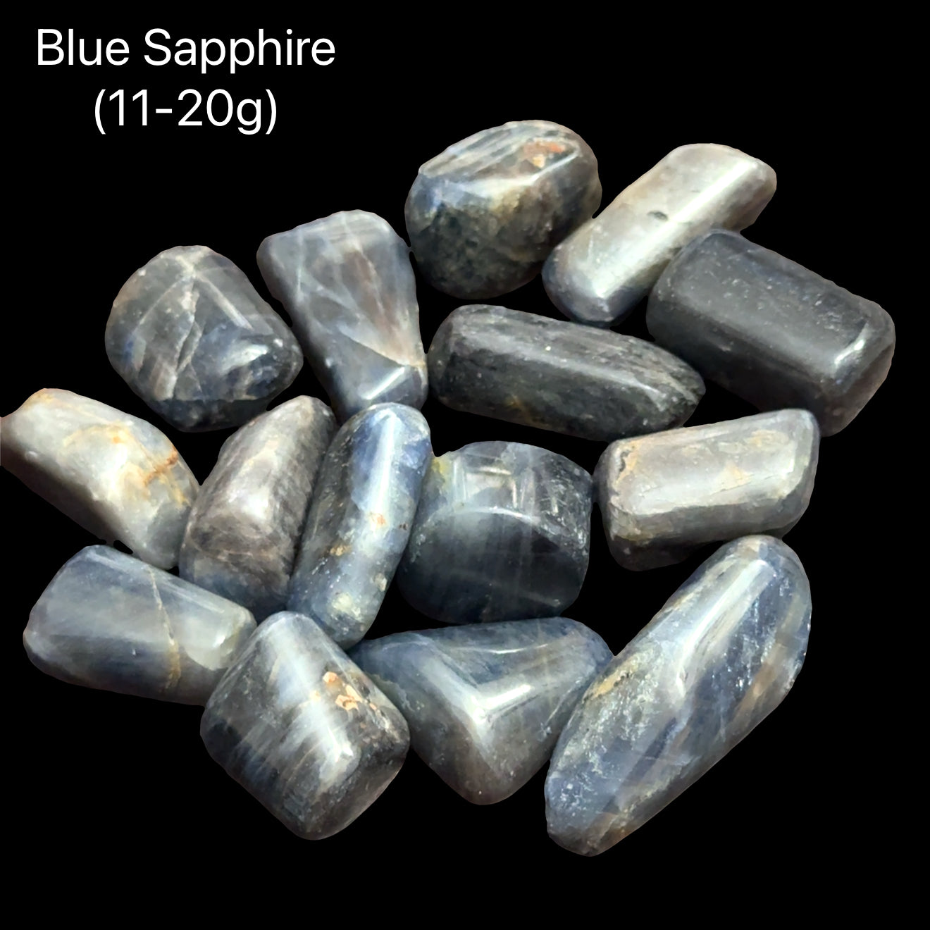 Two blue sapphires on a black background with text indicating weight range (11-20g), front view.