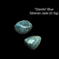 Two blue stones labeled 'Dianite Blue Siberian Jade' on a black background, (0-5g), front view.