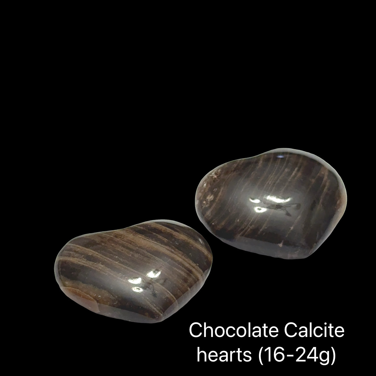 Two chocolate calcite hearts (16-24g) on a black background, front view.