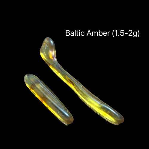 Two pieces of Baltic Amber on a black background with text indicating weight range (1.5-2g), front view.
