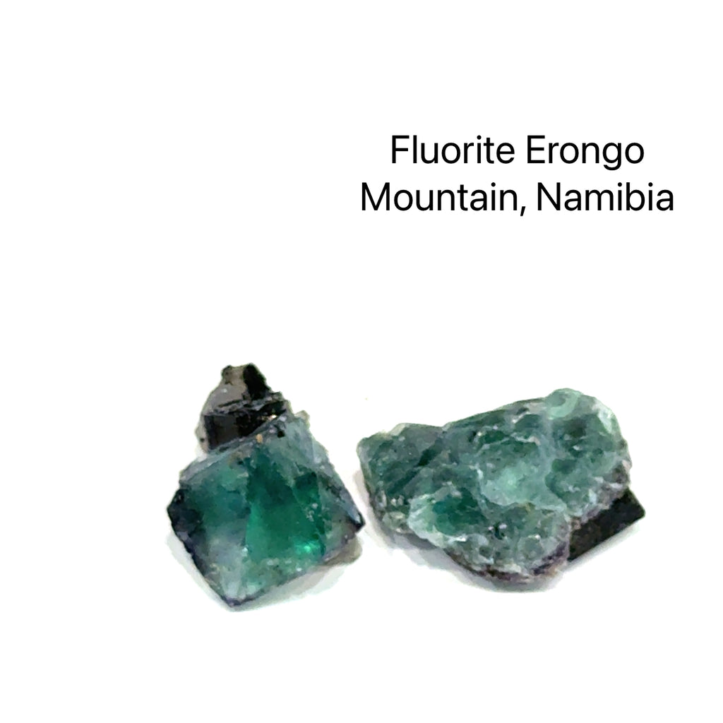 Two pieces of fluorite from Erongo Mountain, Namibia, on a white background, front view. 