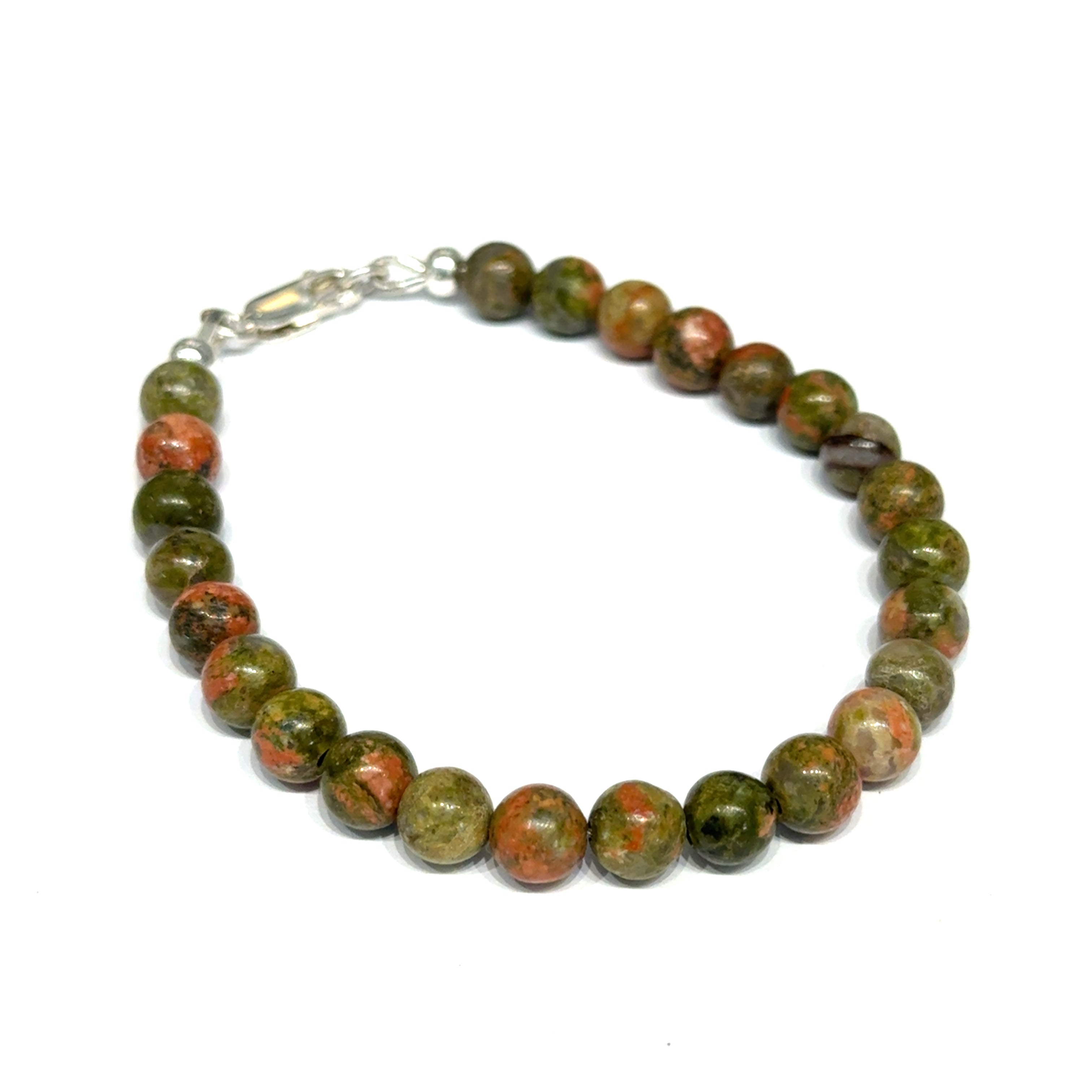 Unakite beaded bracelet with 6mm smooth round gemstones and a sterling silver lobster-claw clasp for gentle emotional healing, on a white background, right-angle close-up view. 