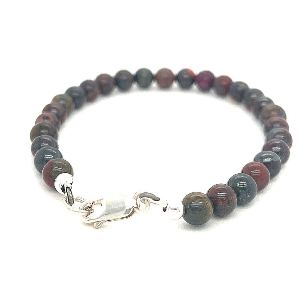 Unique Brecciated Jasper bracelet for Root and Sacral chakra alignment on white back overview