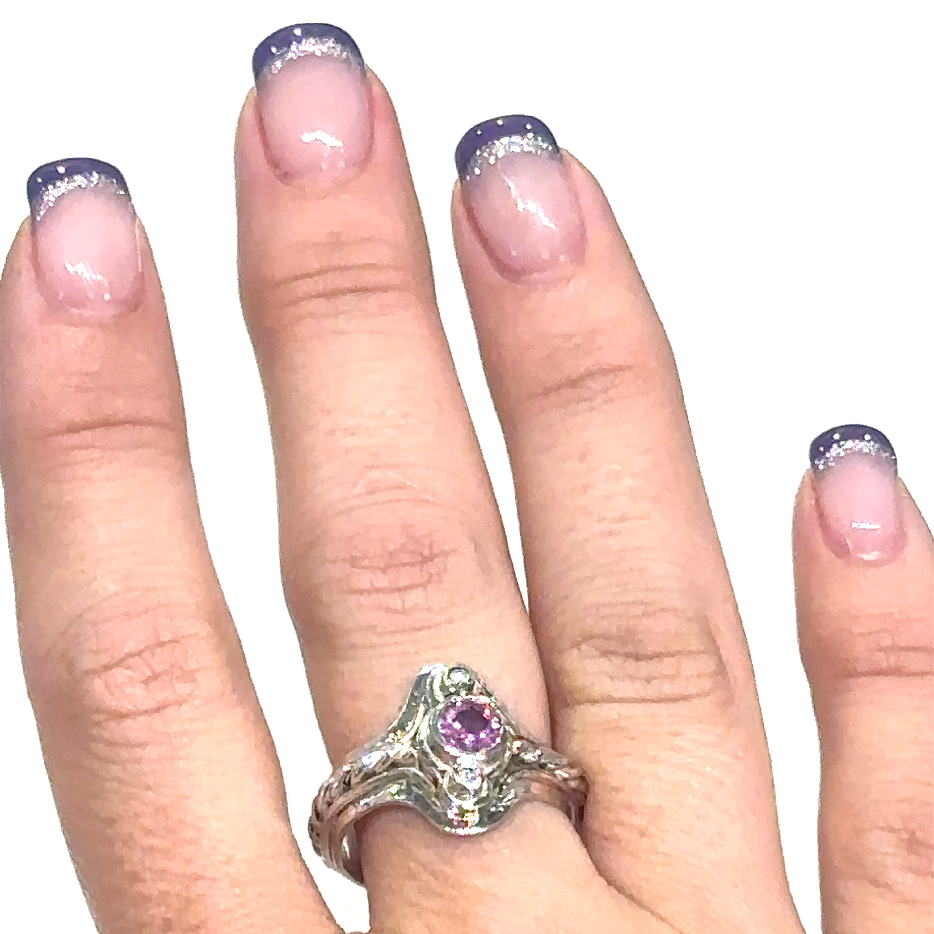 Unique Pink Sapphire and diamond sterling silver ring with rope design detailing on white on ring finger view