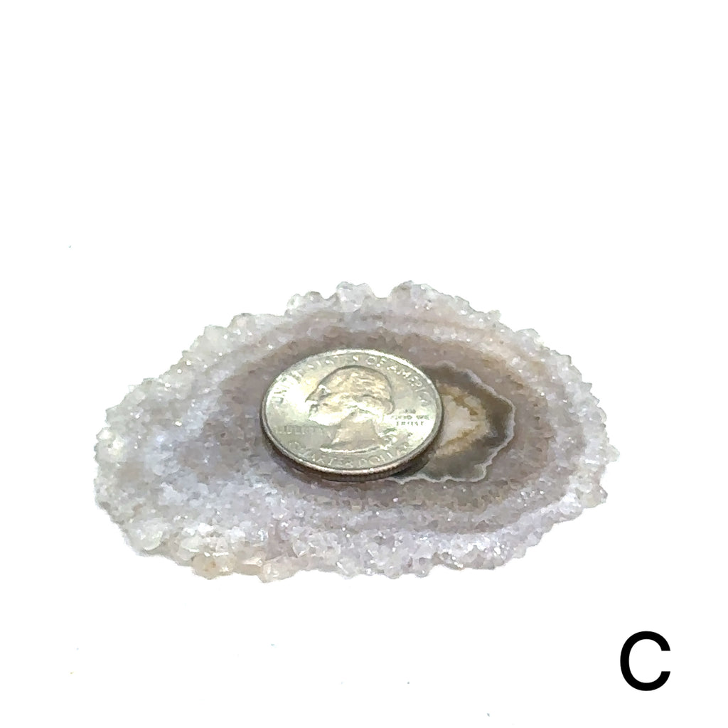 Unique agate stone slice for meditation and chakra balancing #C on white front and center view with quarter on the agate to show sizing
