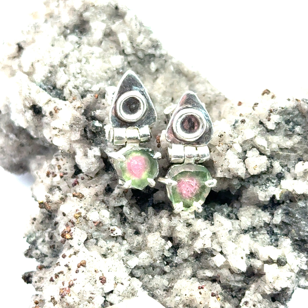Watermelon Tourmaline Slice Earrings on white and rock front view 
