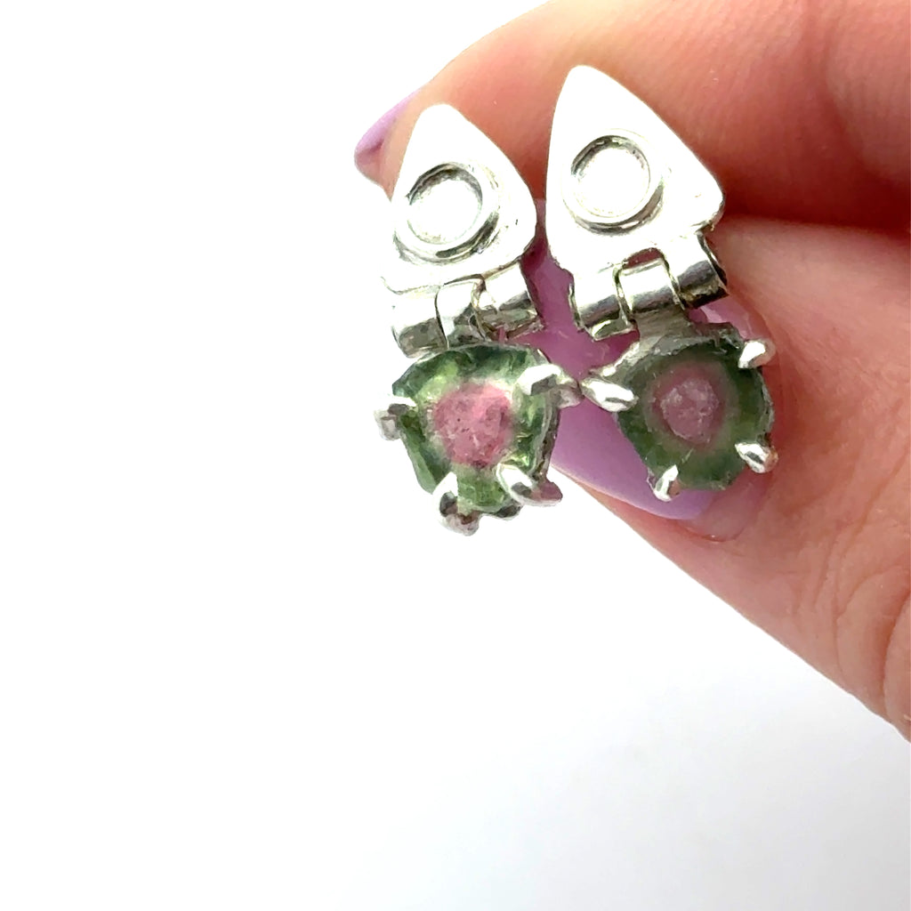 Watermelon Tourmaline Slice Earrings on white in finger tips front view