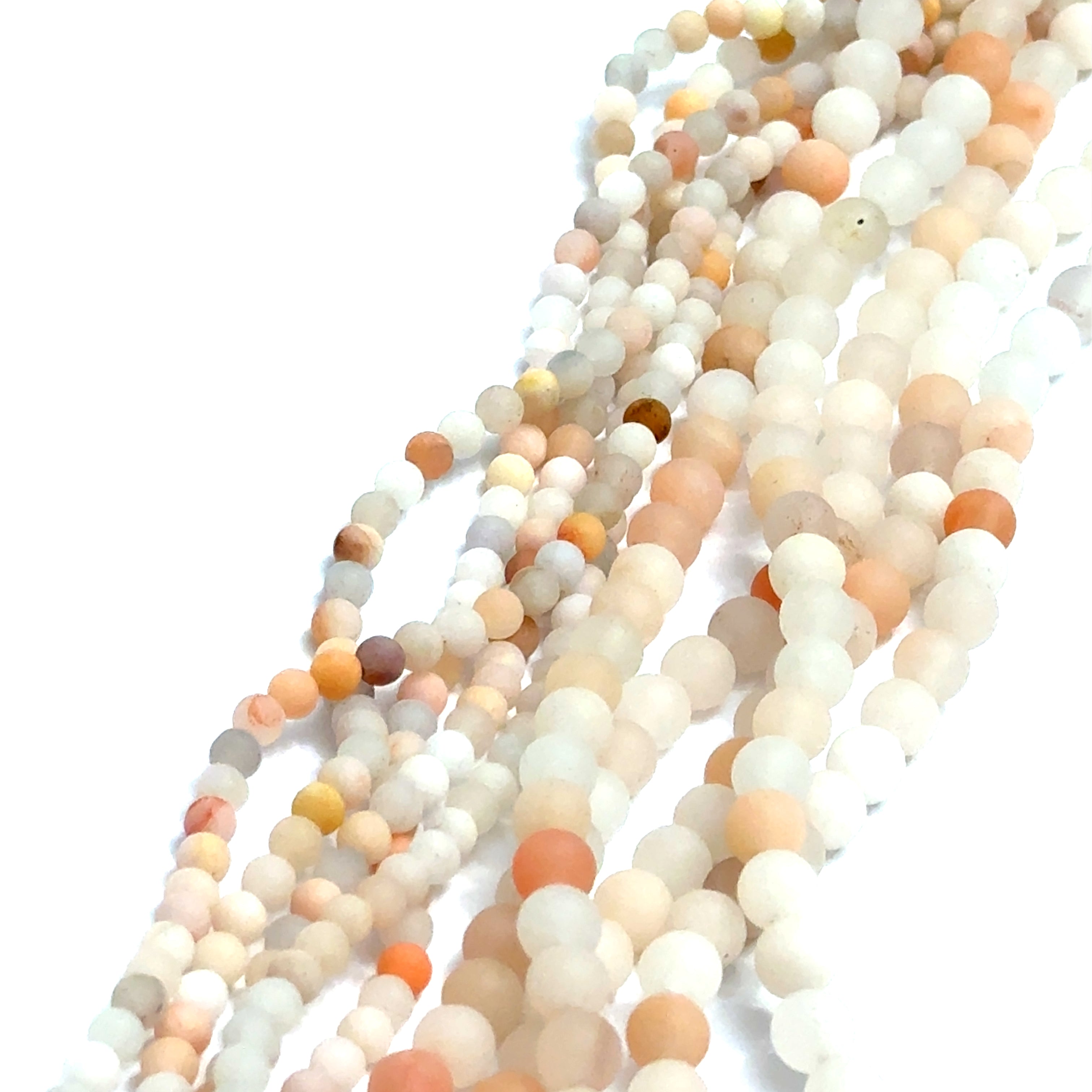 White and Peach Aventurine gemstone strands displaying two different sizes on a white background, overview. 