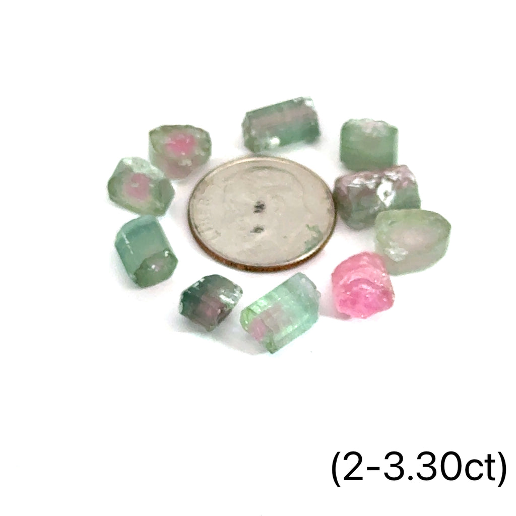 gemstone showing pink and green layers on white background front view with dime to show size (2-3.30ct)