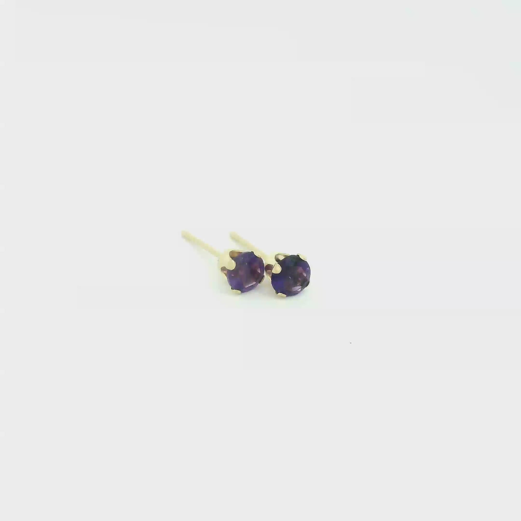14k gold amethyst post earrings with deep purple round faceted gemstones on white background front overview video