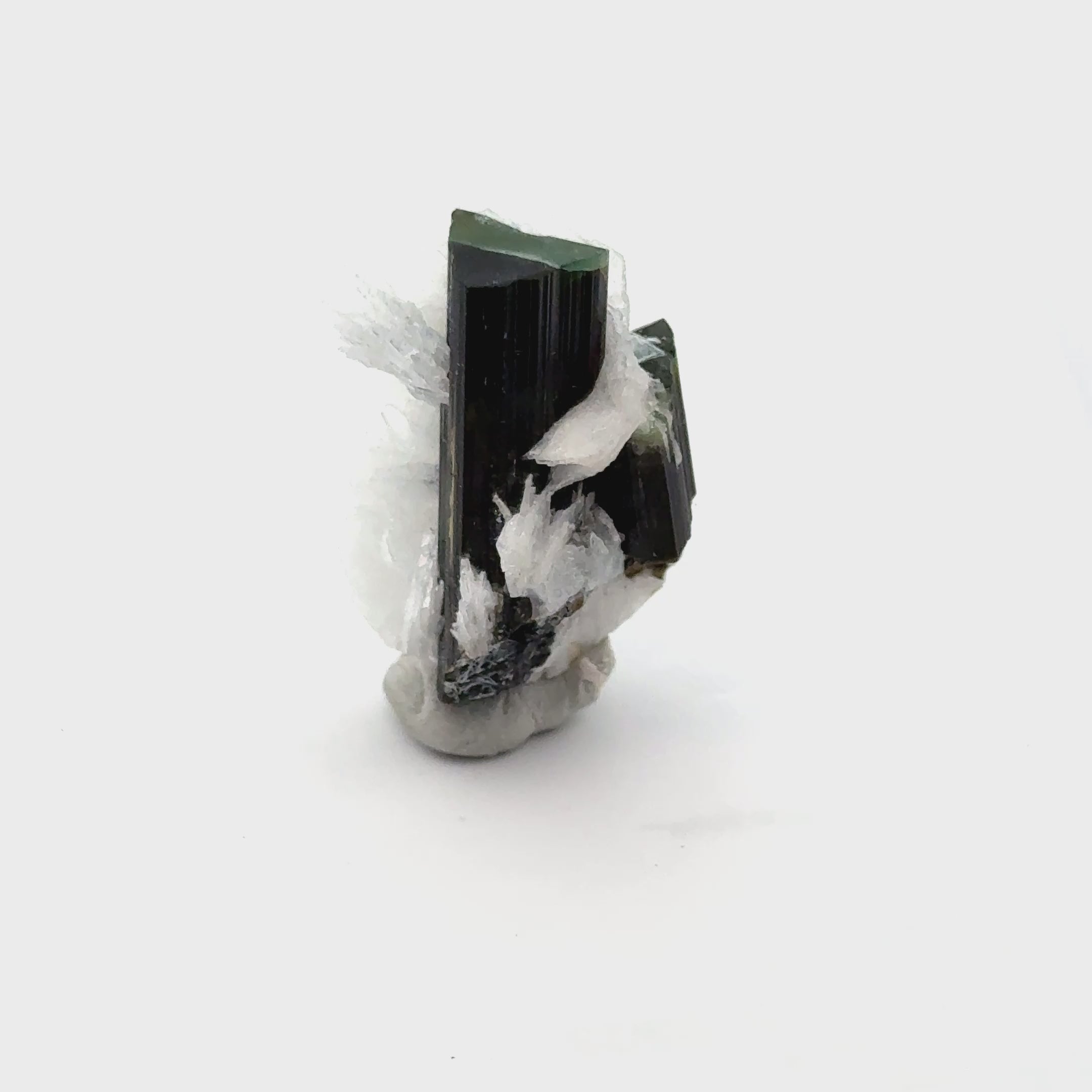 Raw Green Tourmaline with White Barite   19.4g / 97ct on white front view video