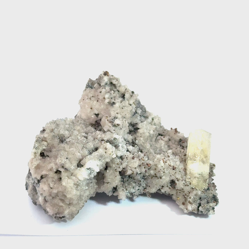 Golden Calcite on Dolomite with Chalcopyrite on white up close front view video