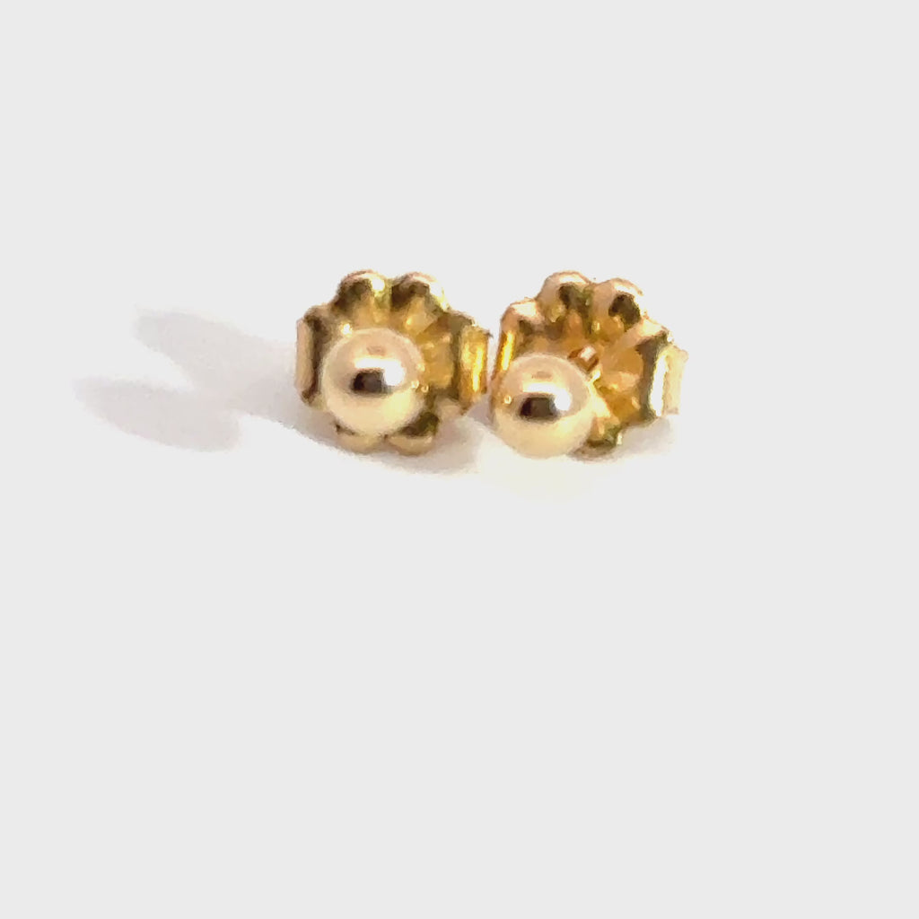 3mm 14kt gold ball stud earrings on white background front overview. video