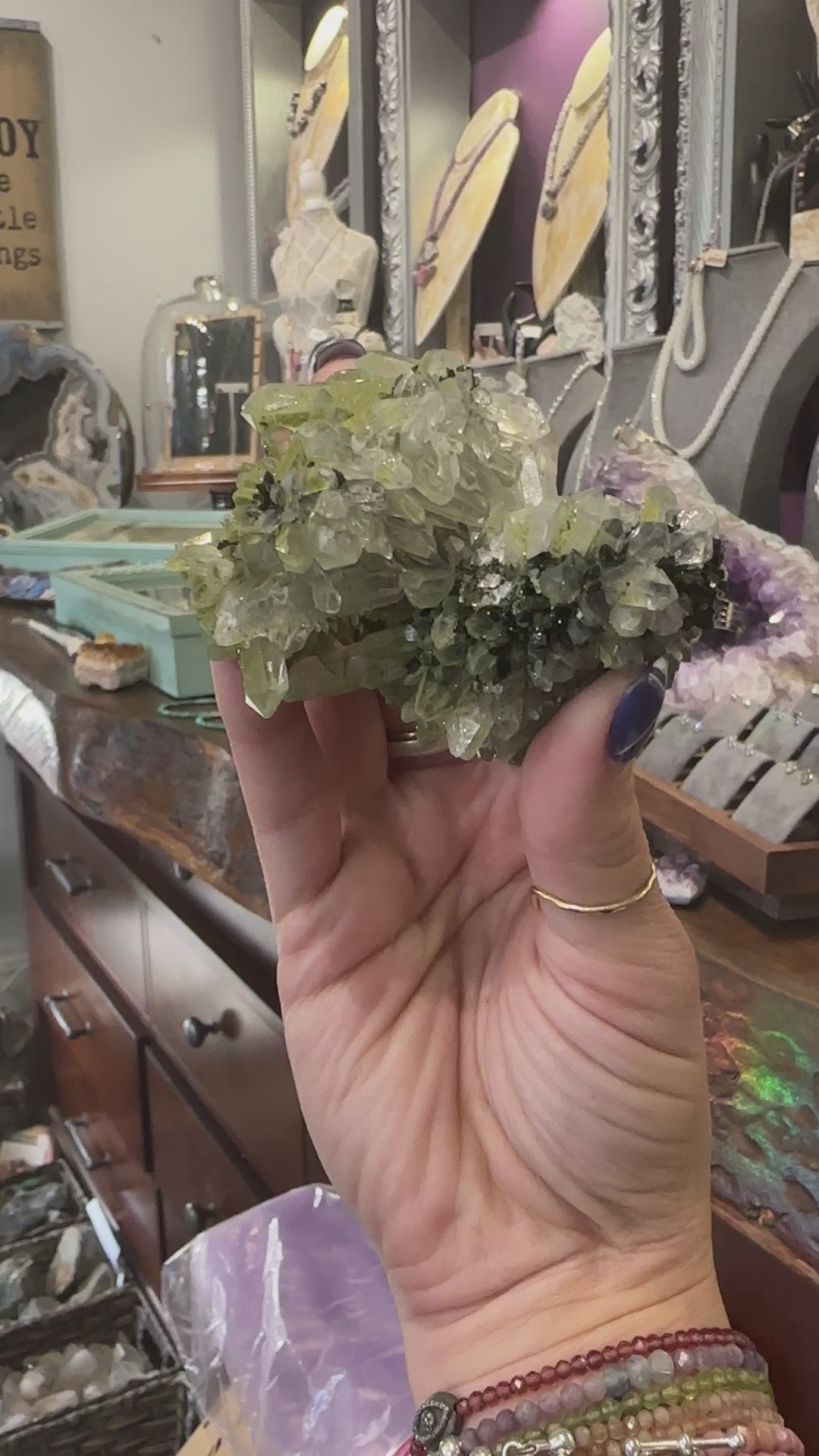 Epidote in Quartz Gemstone Cluster on white close up view video