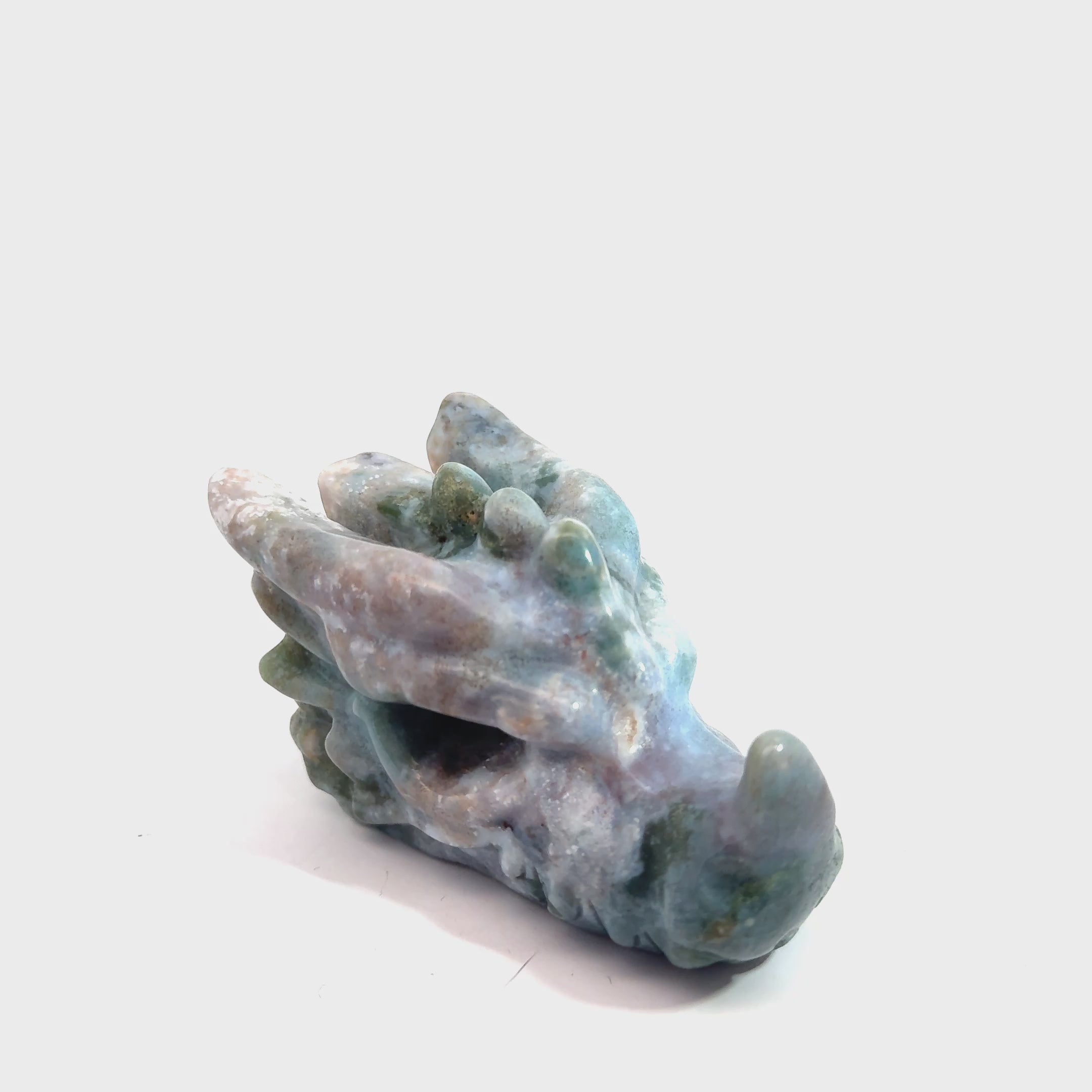Ocean Jasper Dragon Carving on white slight left angle front overview video