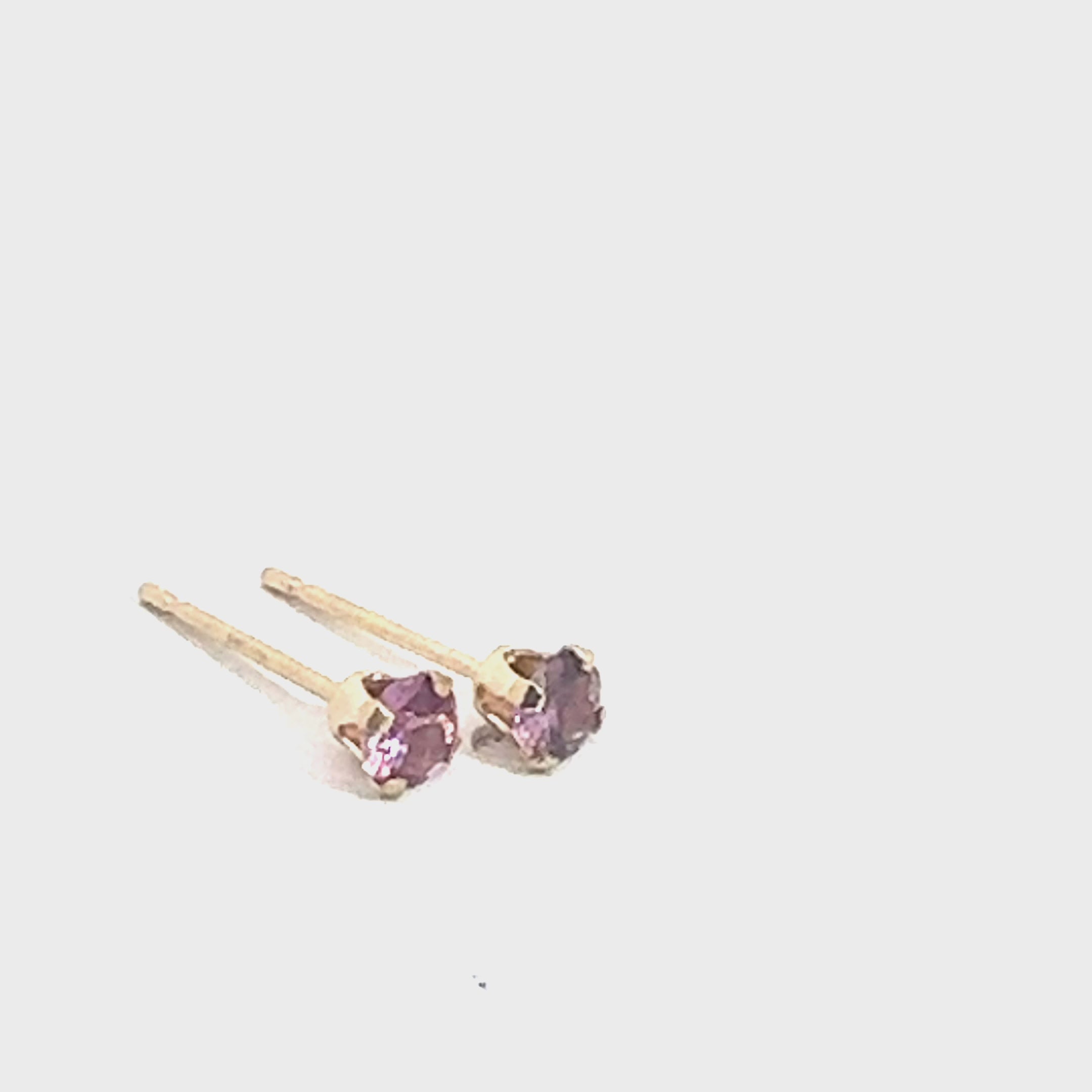 Pink Sapphire Stud Earrings  angled on white overview video