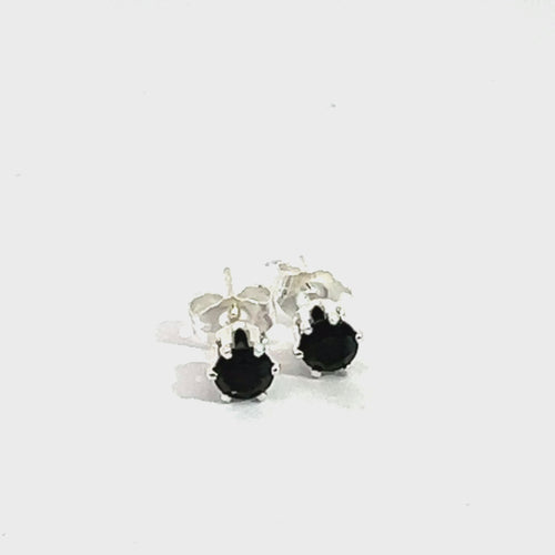 Black Spinel Faceted 4mm Round Post Earrings on white center left angle facing downward overview video