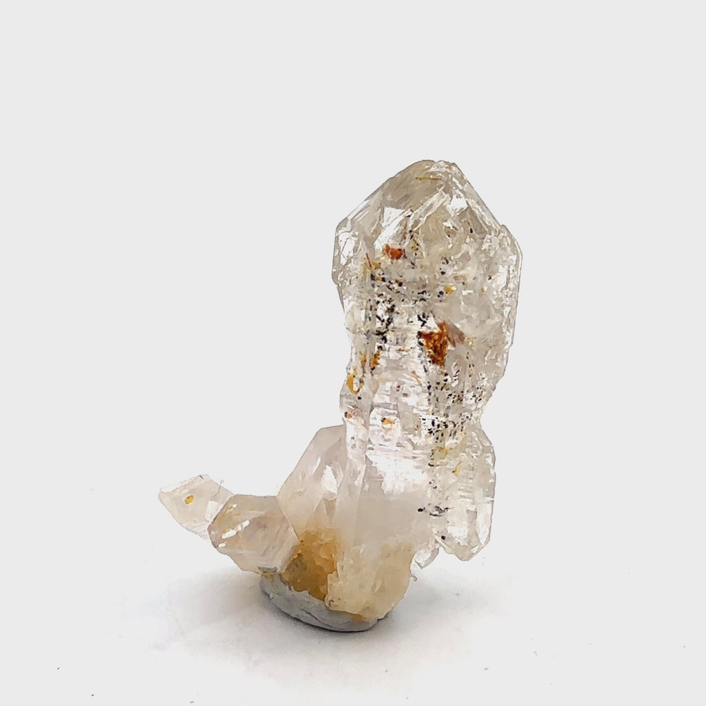 Quartz Raw Gemstone Collector’s Piece #5 on white back overview with blue light video
