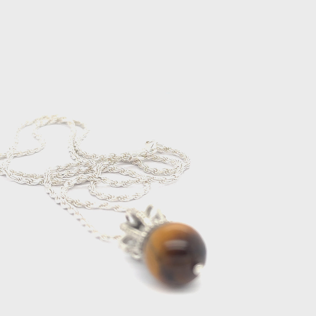 Sterling Silver Crown Pendant with golden tiger eye gemstone on a white background, front overview. video