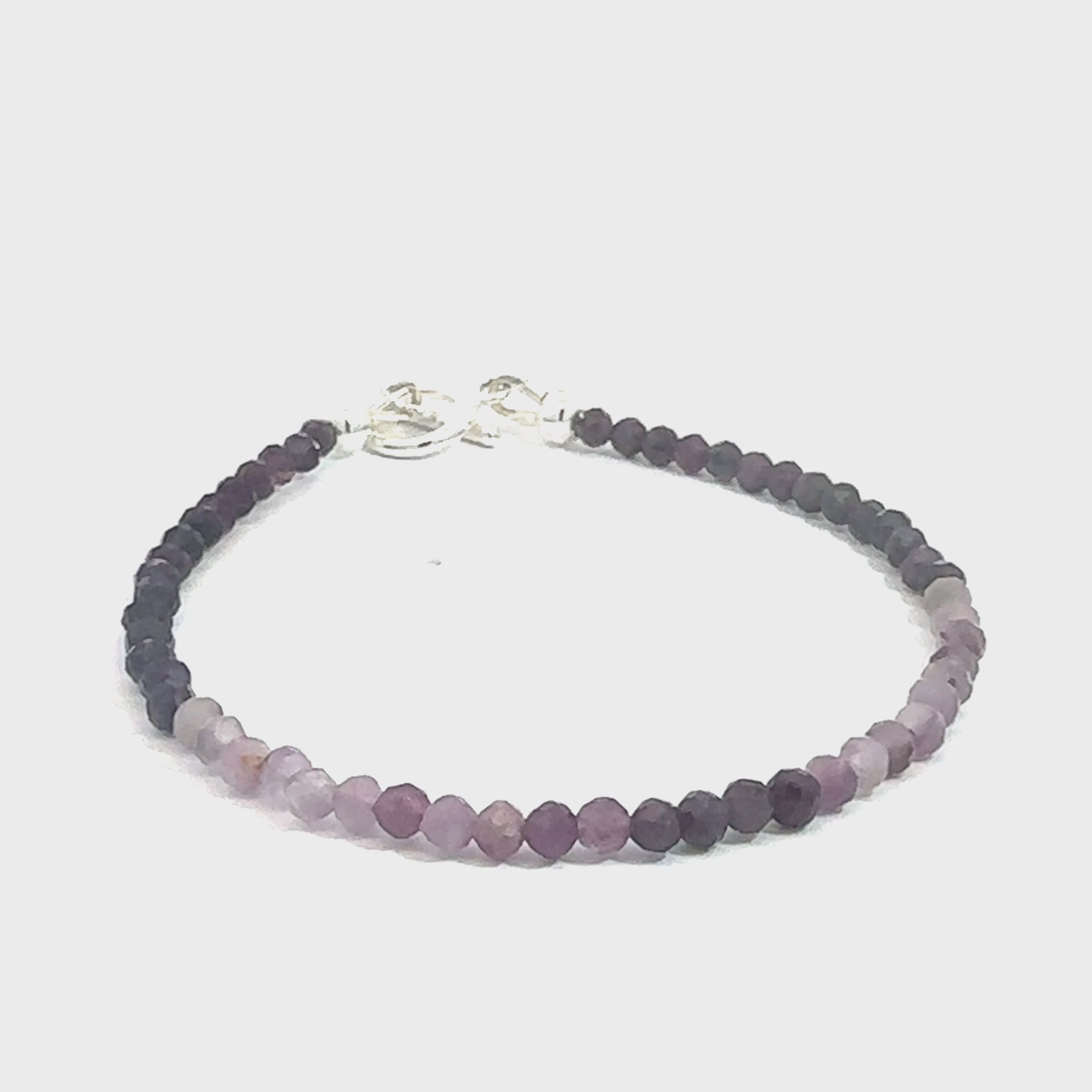 Sugilite Gemstone bracelet on white long overview video