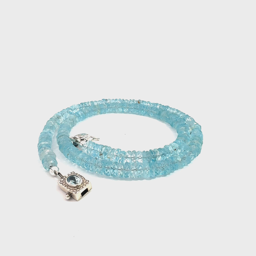 Blue Topaz Gemstone Necklace  on white front spiral overview video