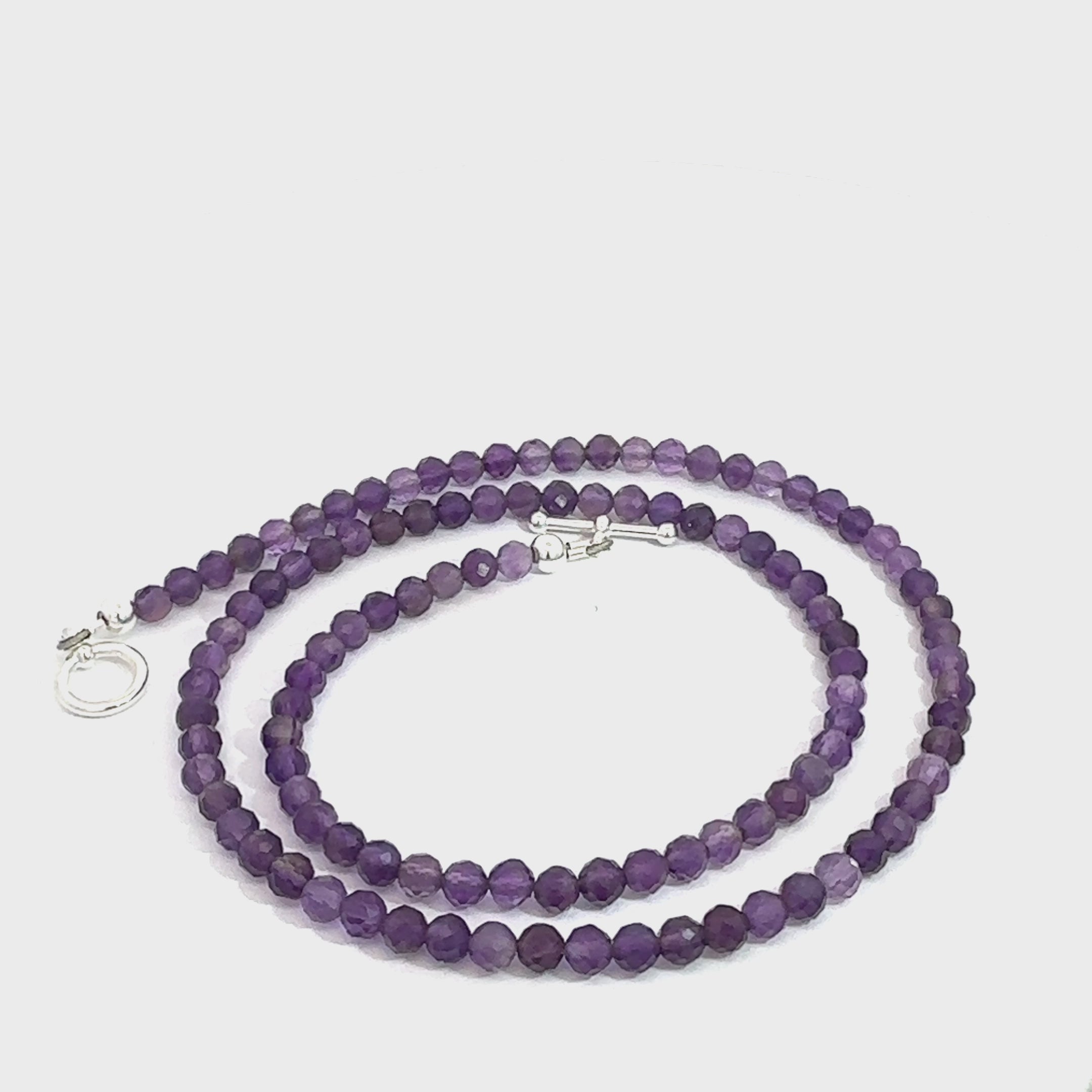 Amethyst Gemstone Necklace on white spiral center overview video