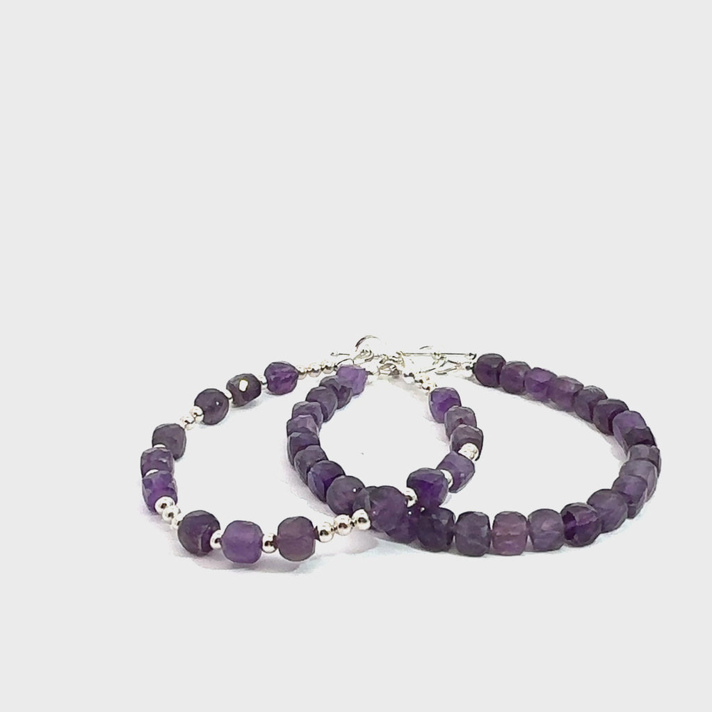 Two beaded gemstone bracelets with Amethyst stones and silver accents, displayed against a white background, front overview. video