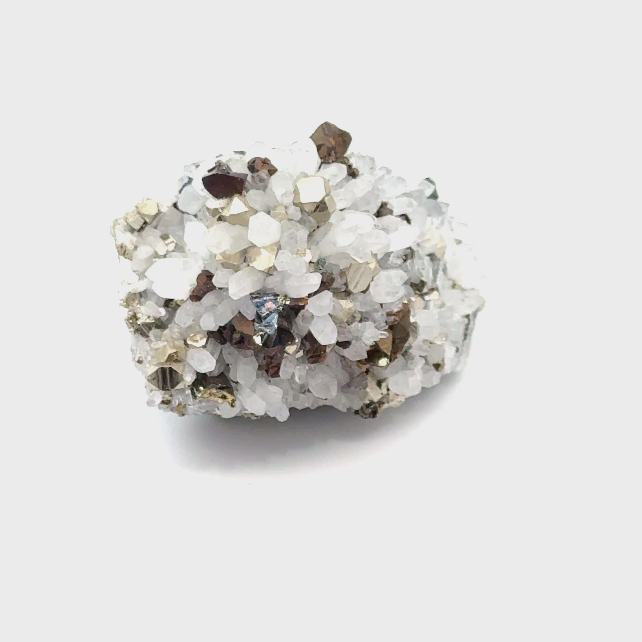 Pyrite in Quartz Gemstone Cluster video on white center front view