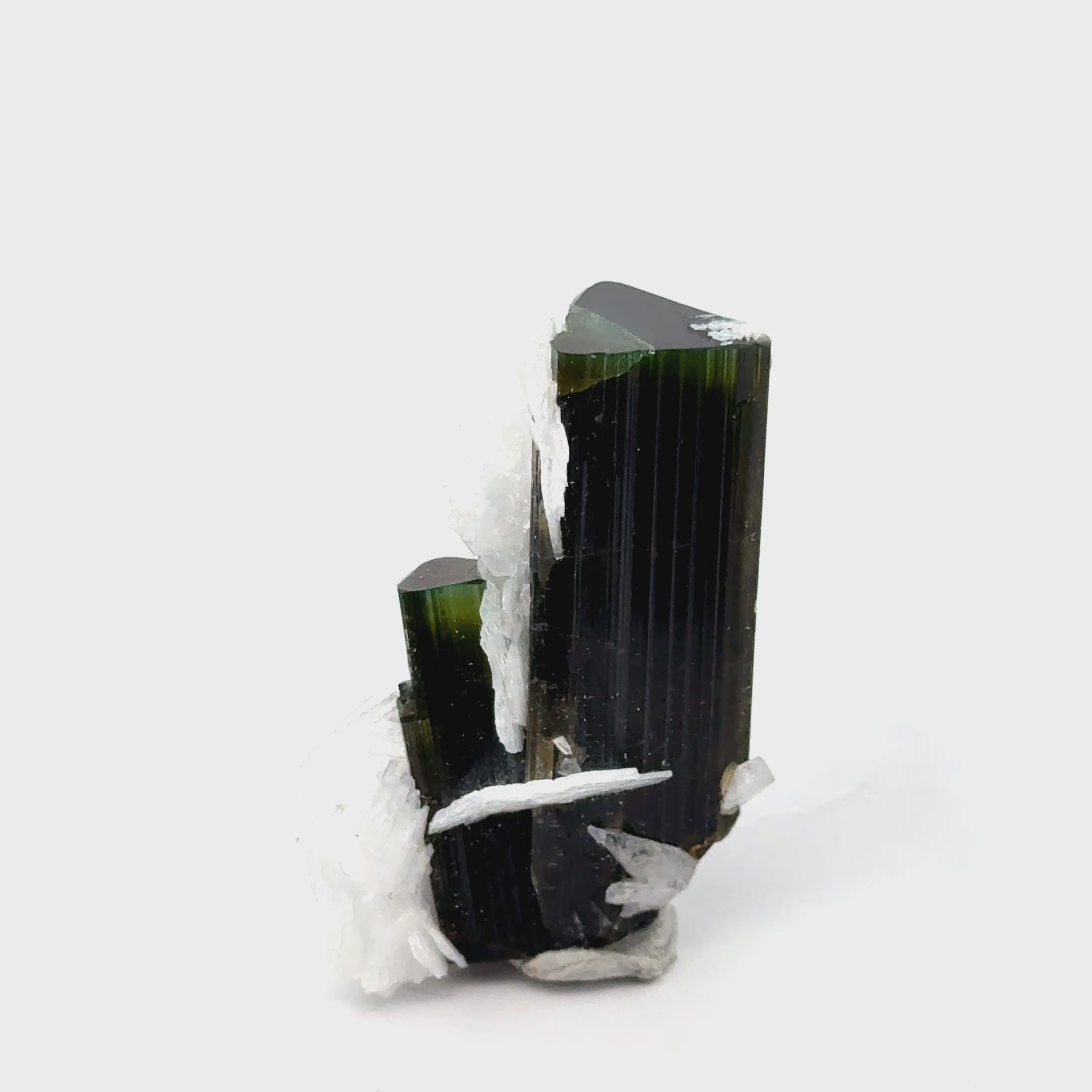 Raw Green Tourmaline with White Barite   24.5g / 122ct on white front view video