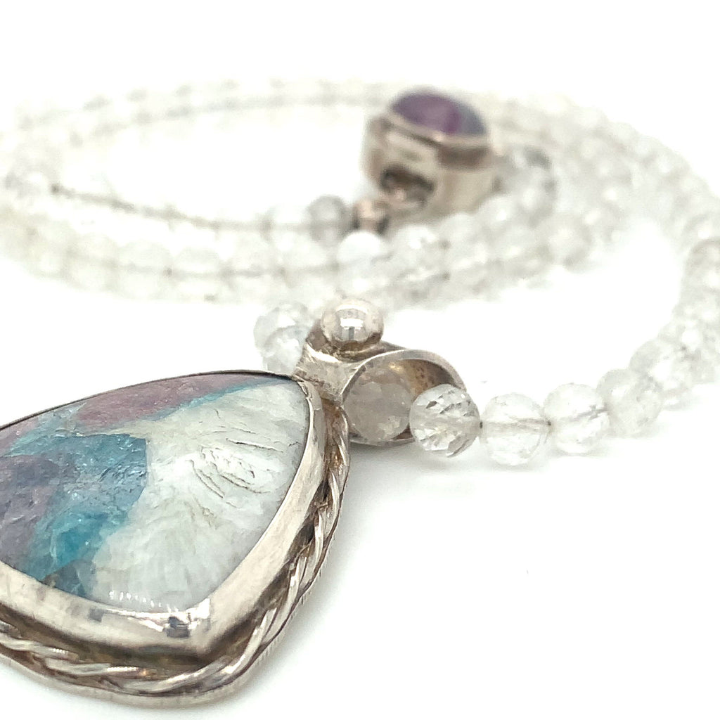Parabia Tourmaline pendant necklace featuring white topaz and sterling setting