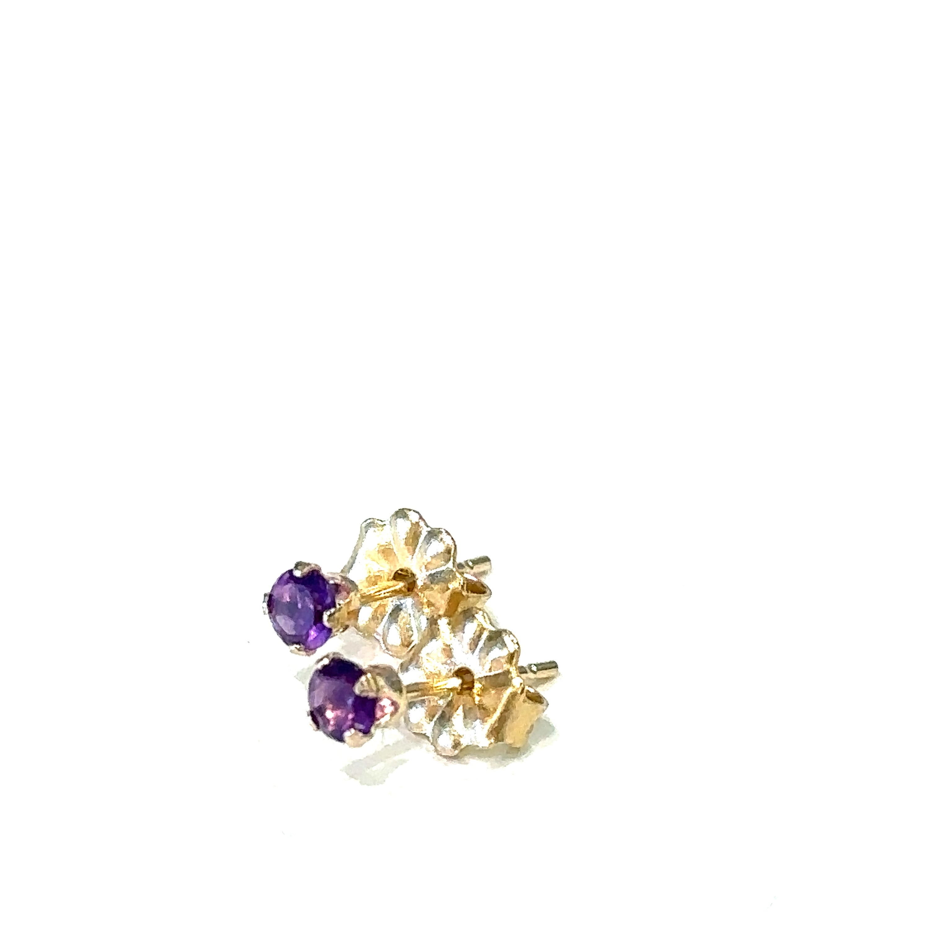 14k gold amethyst post earrings with deep purple round faceted gemstones on white background left side angled front overview