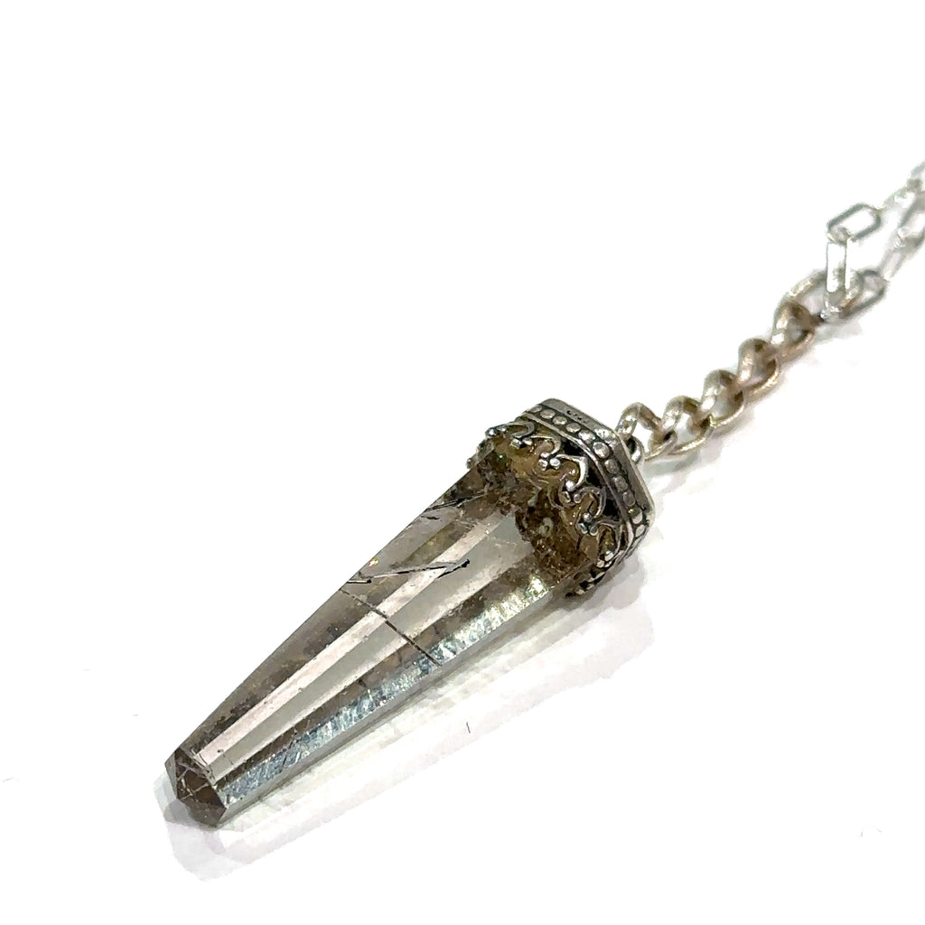 #1 Close-up of golden needle inclusions in Rutilated Quartz gemstone pendant front view on a white background.