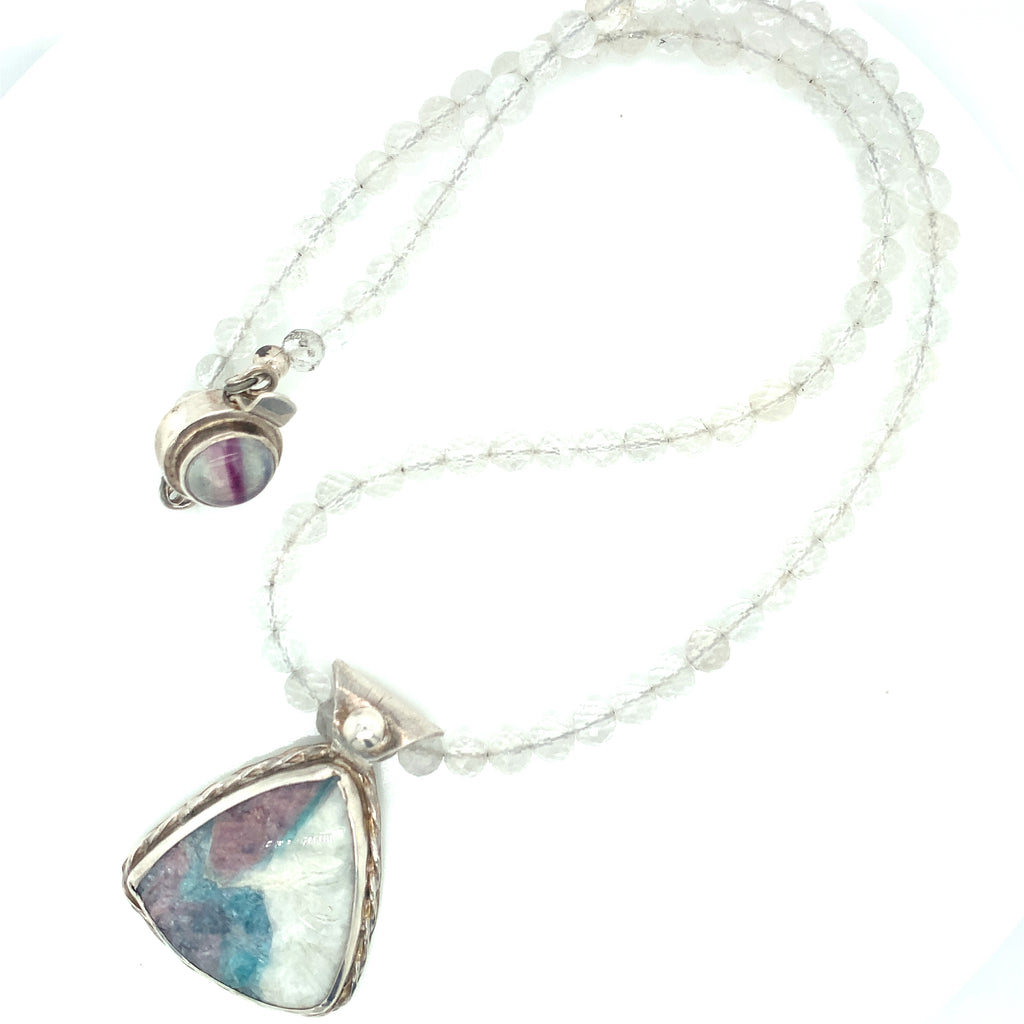Parabia Tourmaline pendant necklace featuring white topaz and sterling setting