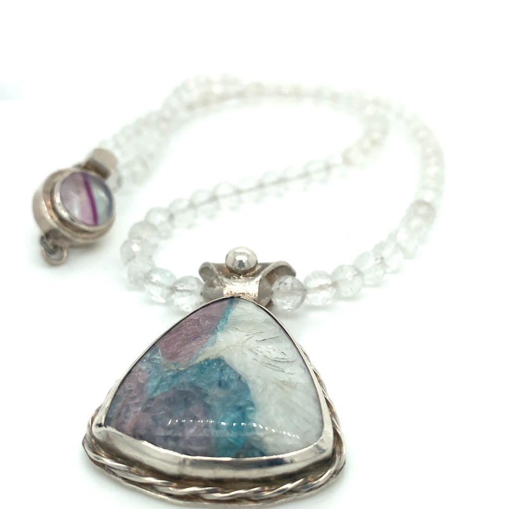 Parabia Tourmaline pendant necklace featuring white topaz and sterling setting