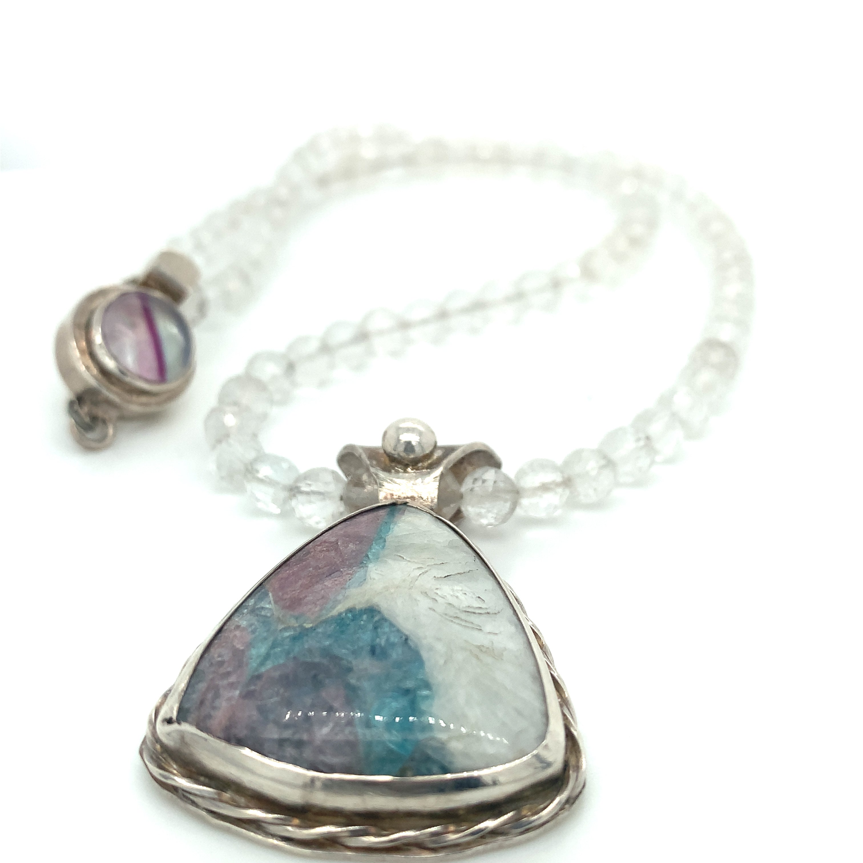 Parabia Tourmaline pendant necklace featuring white topaz and sterling setting