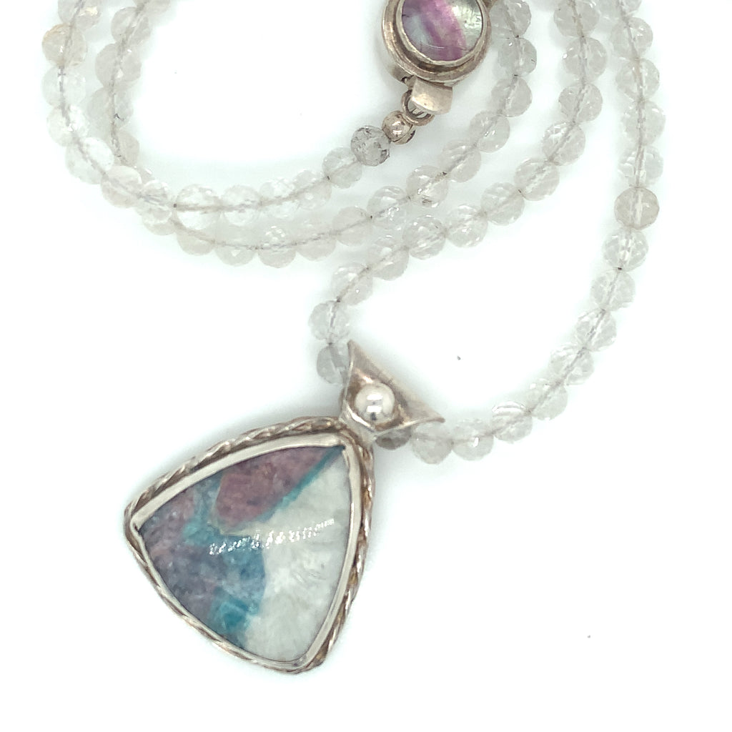 Parabia Tourmaline pendant necklace featuring white topaz and sterling setting