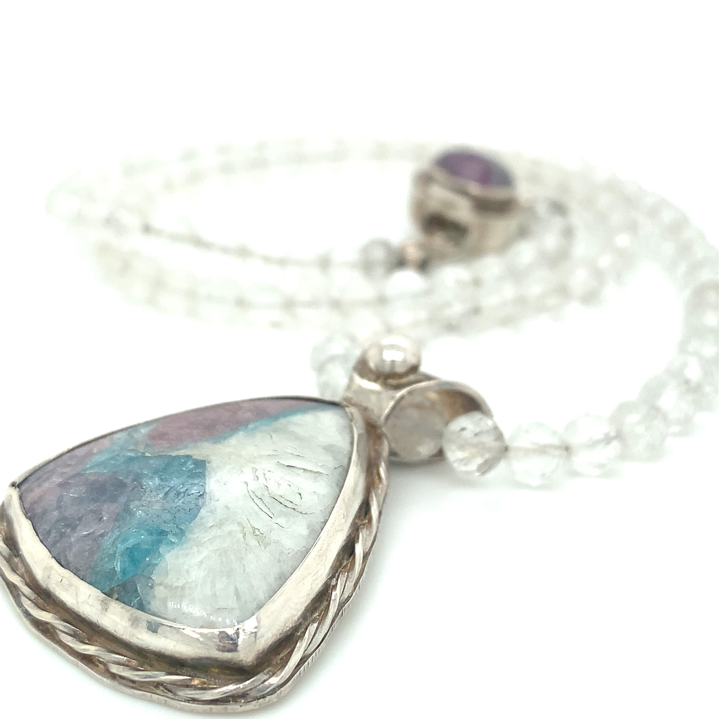 Parabia Tourmaline pendant necklace featuring white topaz and sterling setting