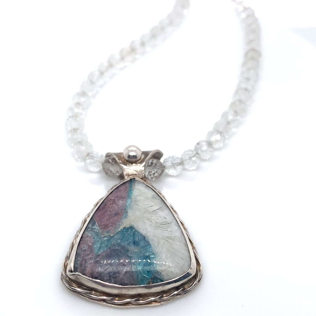 Parabia Tourmaline pendant necklace featuring white topaz and sterling setting