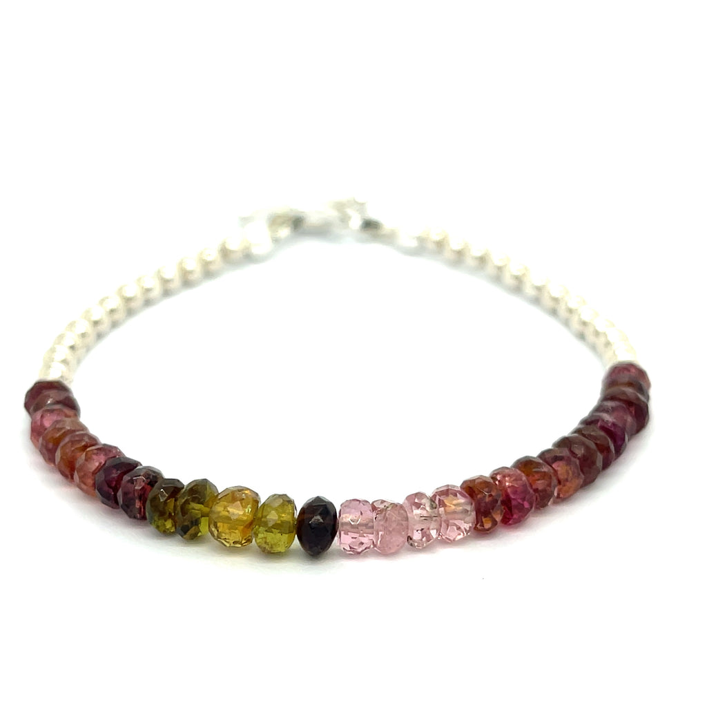 #2 of beaded bracelets featuring tourmaline gemstones in various shades of pink, brown, and green, with sterling silver accents and a silver toggle on a white background, front overview.