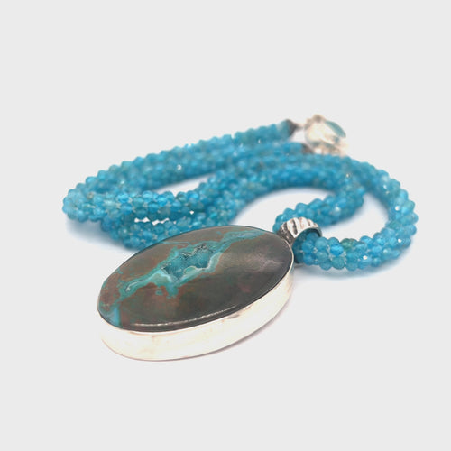 Blue Apatite crocheted gemstone necklace with Gem Silica Druzy pendant handmade by Hidden Jewel. on a white background center overview video