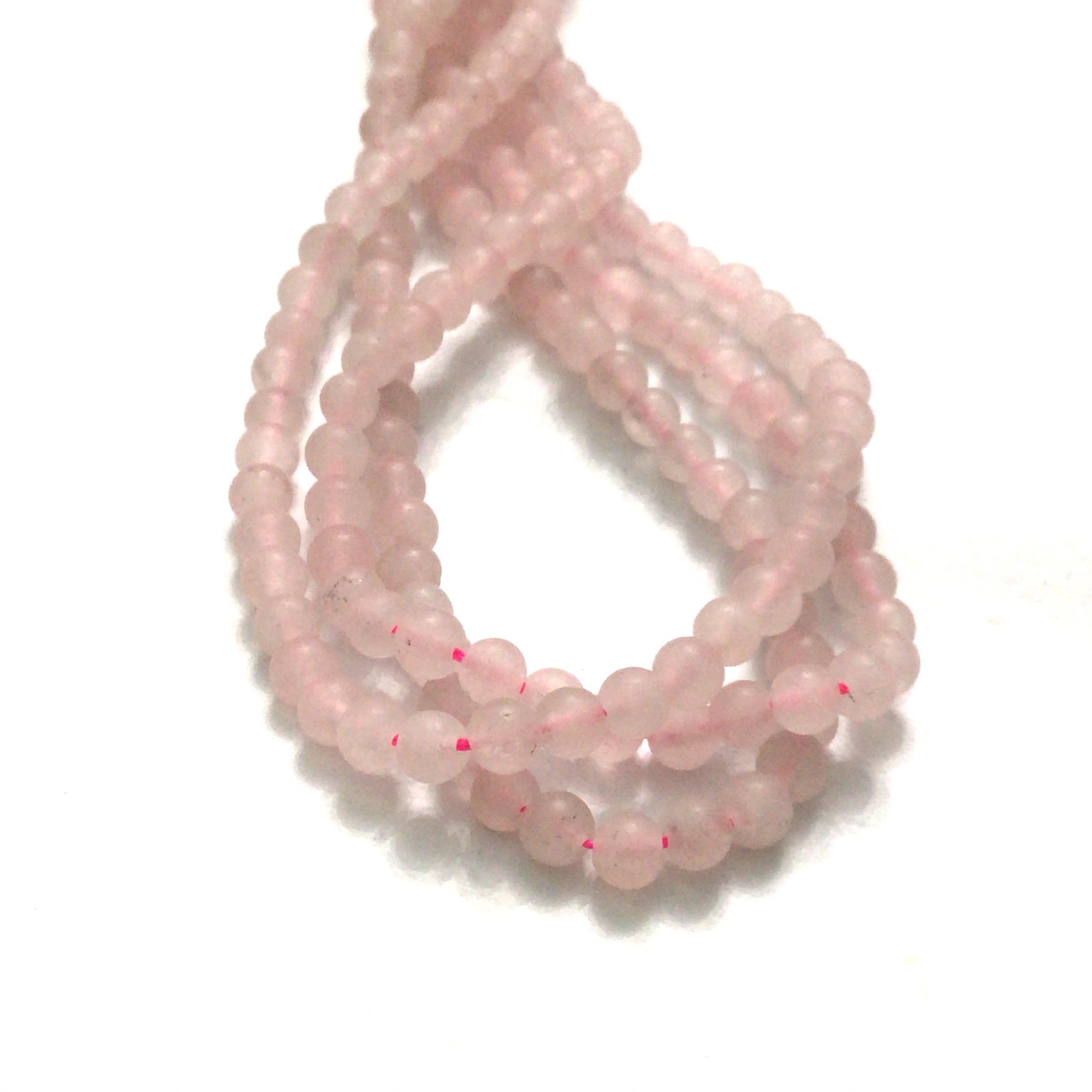2mm  Rose Quartz gemstone beads, smooth round matte, 16'' strand on a white background, overview.